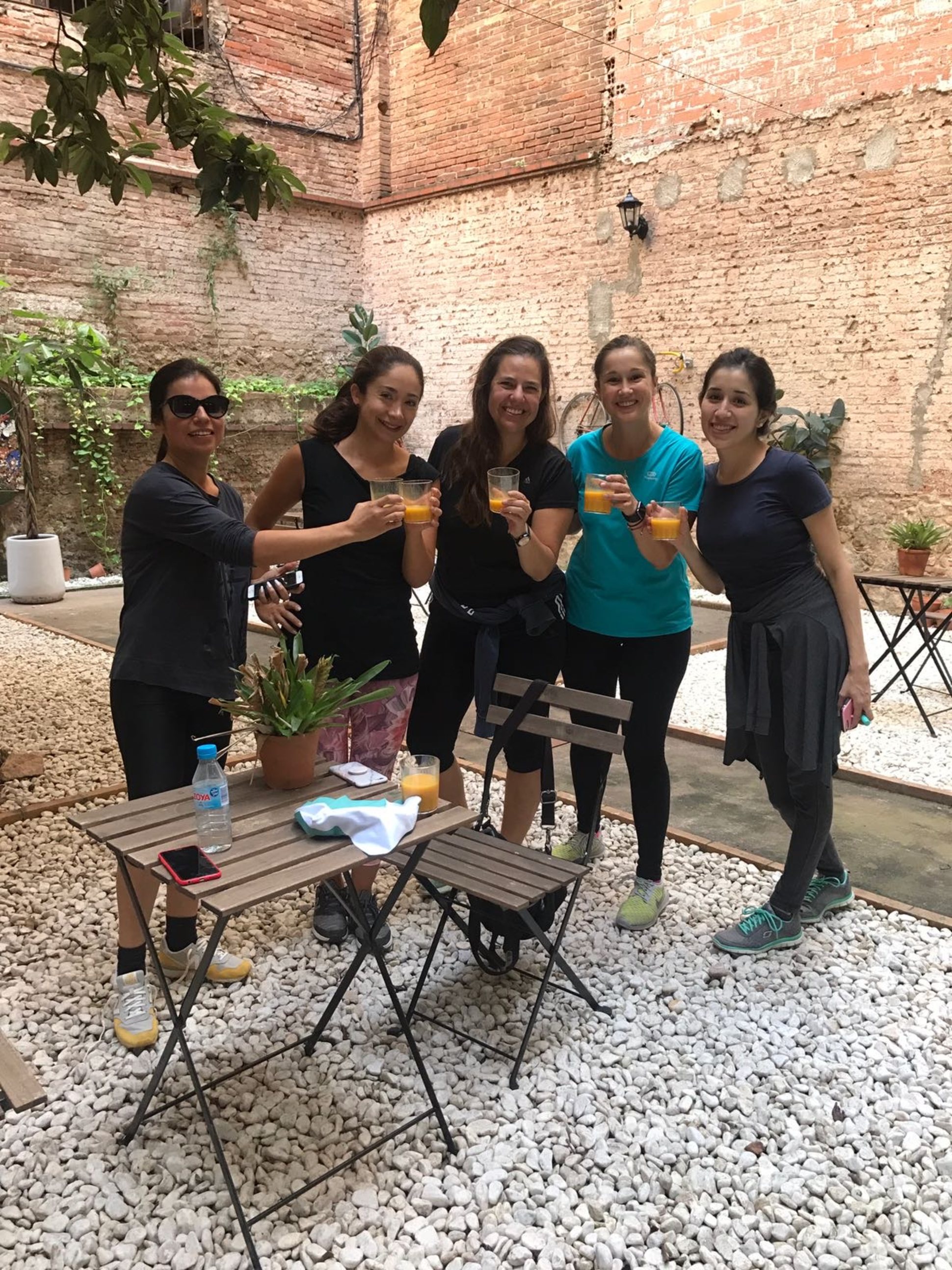 Breasts at the Muments Wellness Barcelona event, drinking a healthy juice